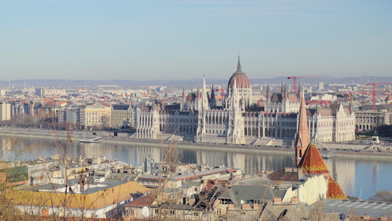 Scenic view of the historic green iron bridge over the Danube river in Budapest.