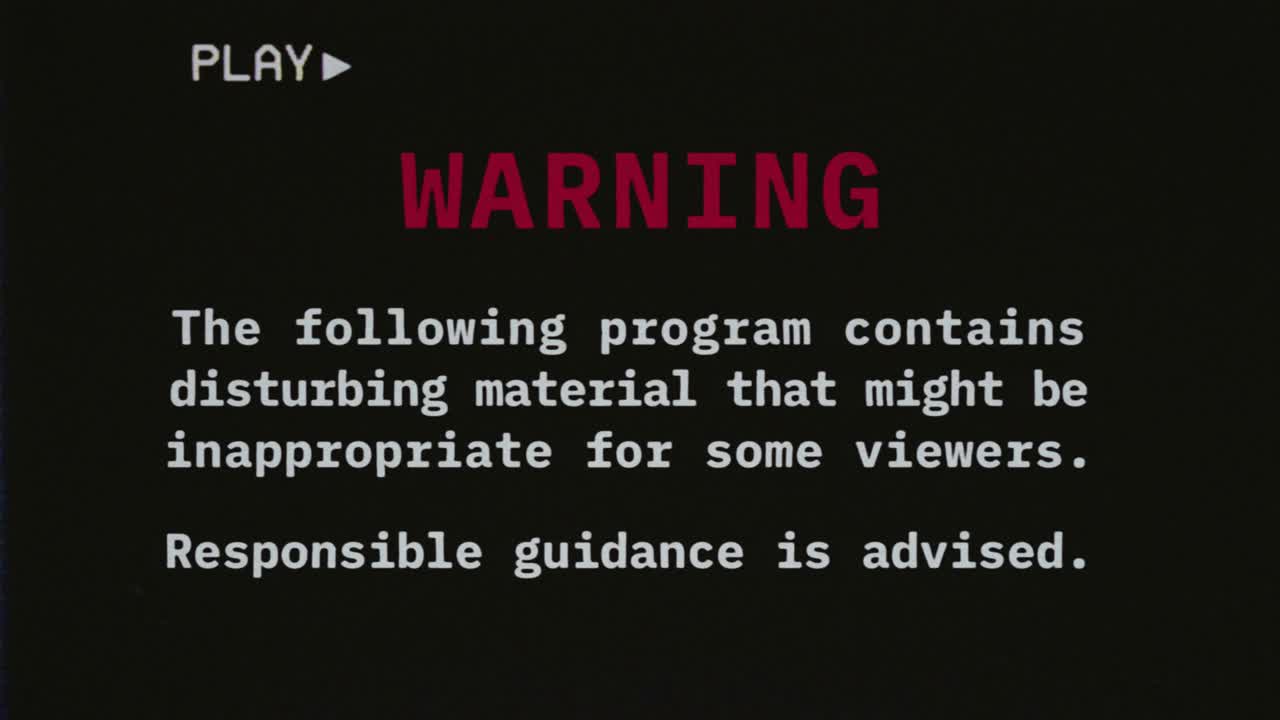 Reconstructed fake VHS tape capture contains a warning text message about disturbing material, inappropriate for some viewers