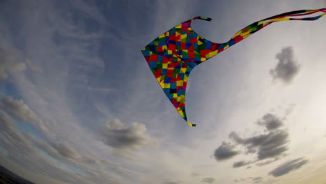 colorful kite soaring in a dramatic sky