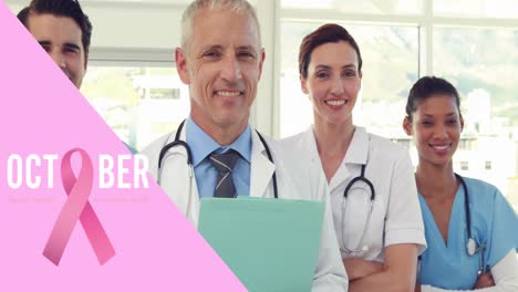 animación de la cinta rosa del cáncer de mama sobre un grupo de médicos sonrientes