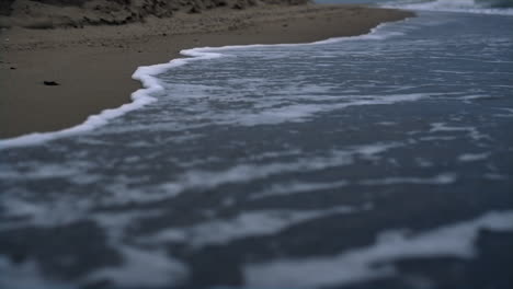 crashing waves storming beach coast on sea landscape. blue ocean water outdoors.