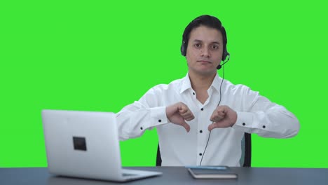 Disappointed-Indian-call-center-employee-showing-thumbs-down-Green-screen