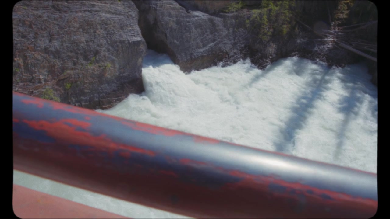 Walking on the bridge above waterfall