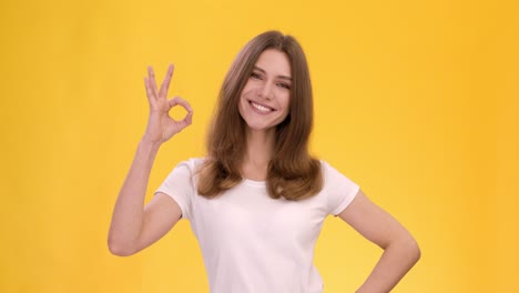 woman making an ok hand gesture