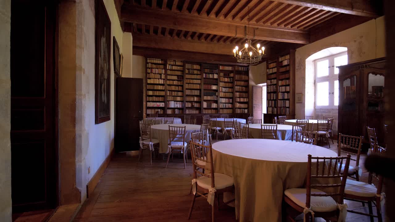 In a medieval chateau,an opulent library room reveals its ancient ...