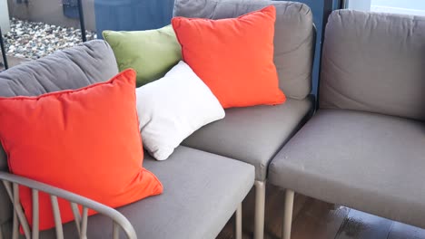 outdoor sofa with colorful pillows