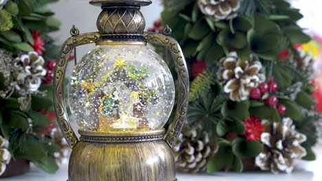 snowglobe with child in the manger on christmas background