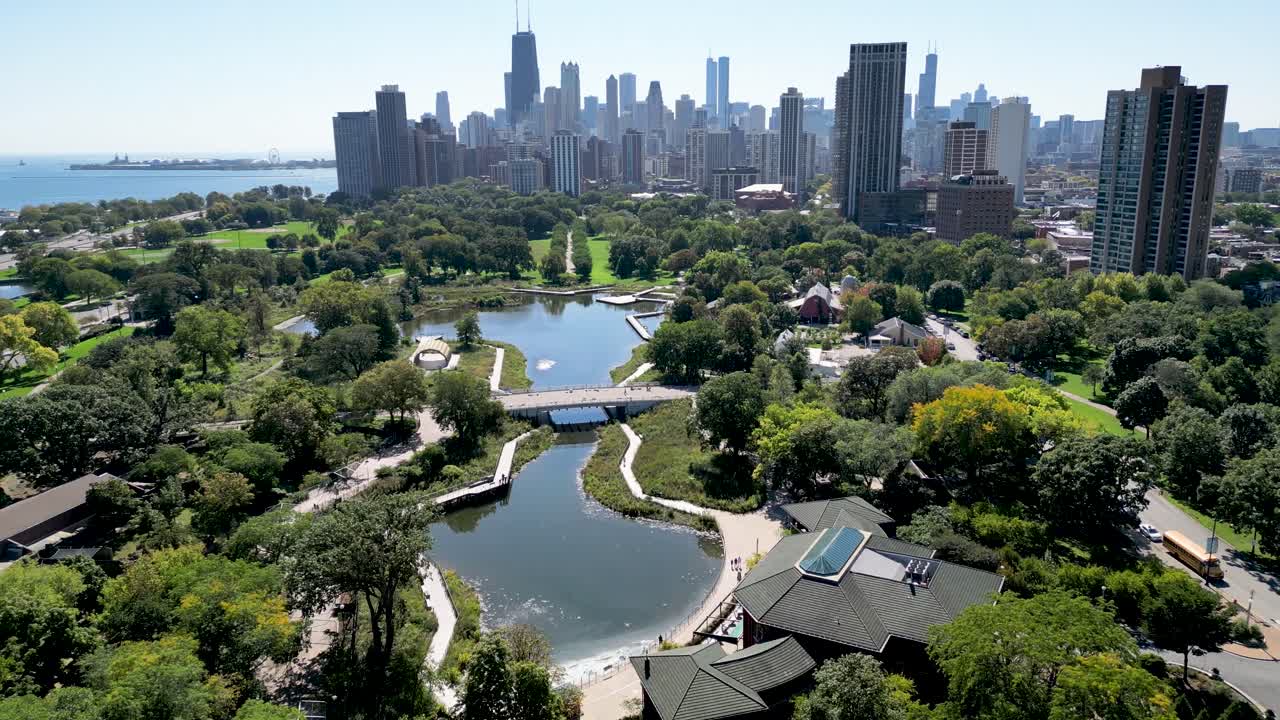 High resolution beautiful panoramic aerial drone 4K video of Lincoln Zoo Chicago and Chicago's skyline and its surrounding area