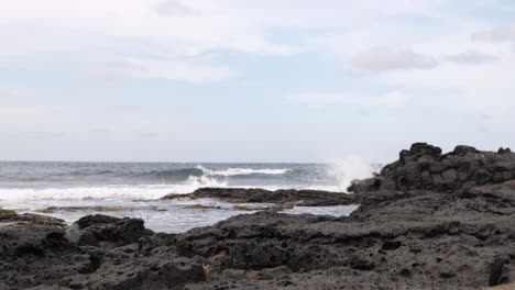 Ocean-waves-crashing-against-rocks-on-coast-of-Udo-island-in-Korea