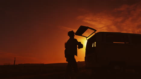 road trip, sunset and silhouette of friends in car