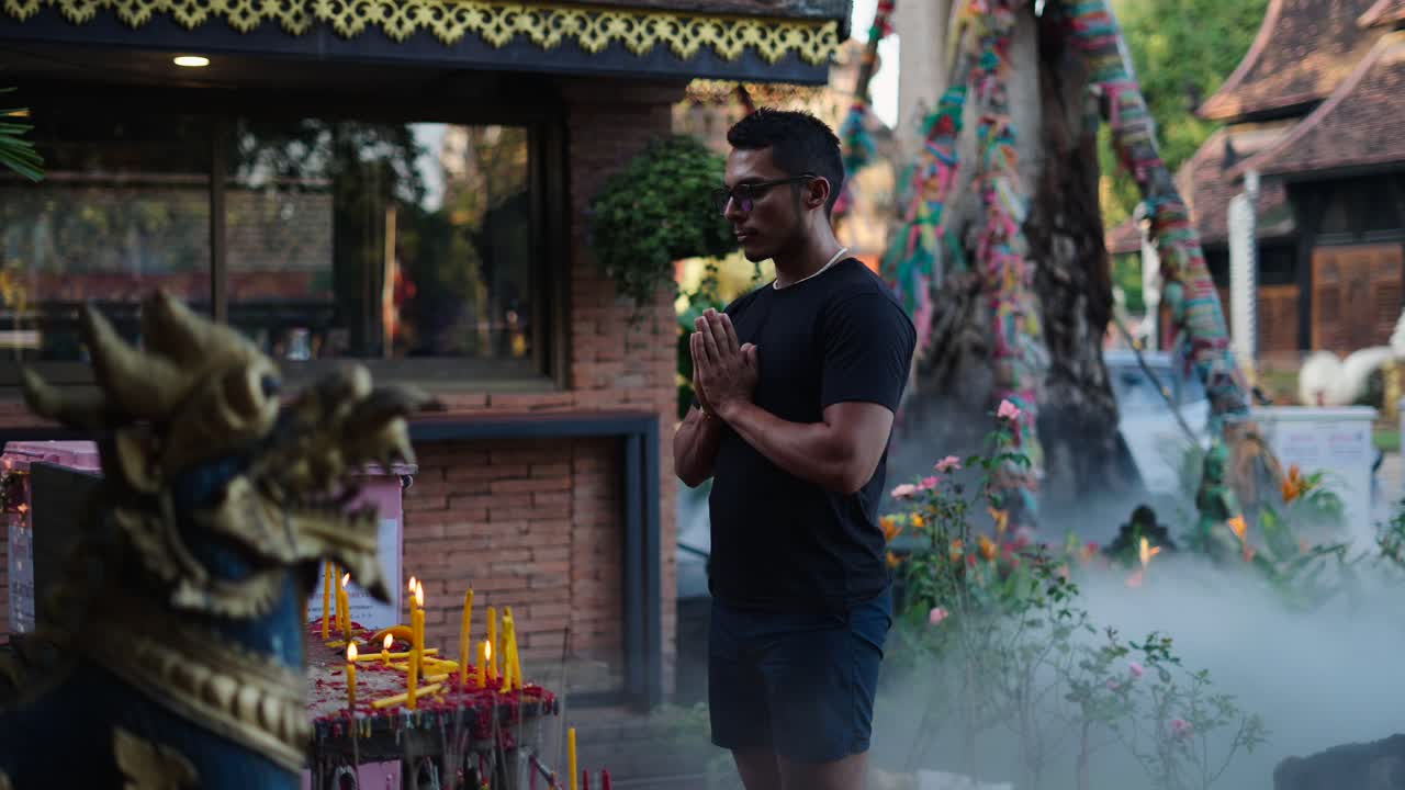 Man Praying at a Thai Temple