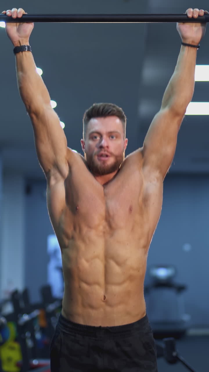 Muscular Man Working Out in Gym