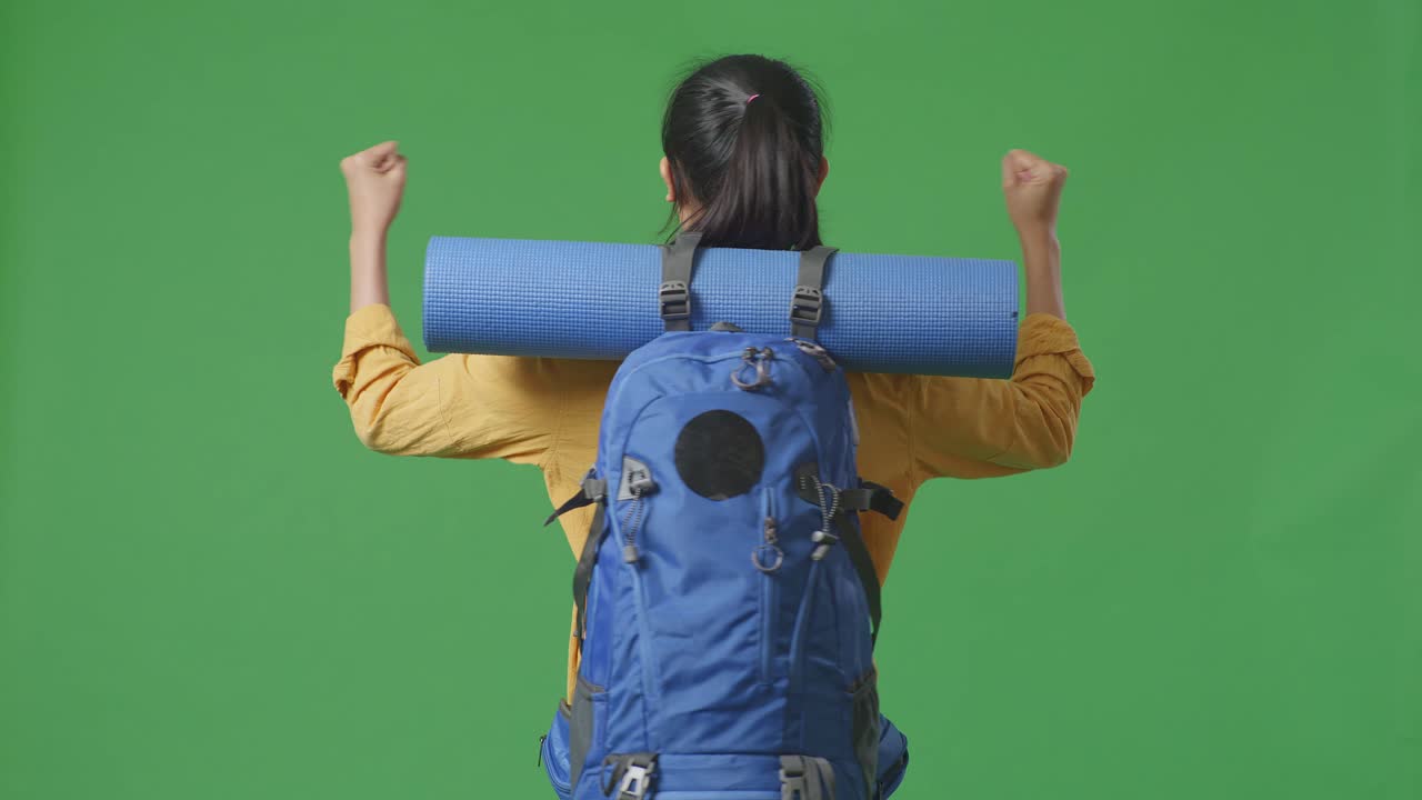 Woman with Backpack and Yoga Mat
