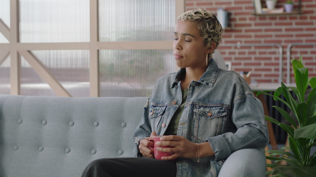 beautiful african american business woman drinking coffee using smartphone browsing social media messages texting sharing successful career ideas in modern office workplace