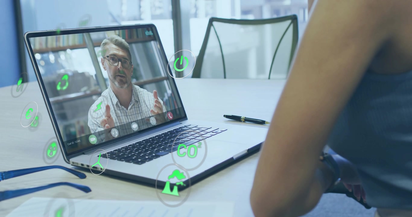 Woman connecting laptop in business meeting and watching animated environmental icons shifting