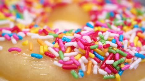 close-up of a colorful sprinkled donut