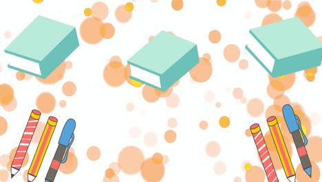 animation of orange spots over pen, pencils and blue books