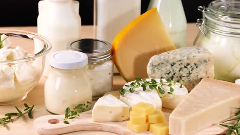 variety of dairy products on a wooden surface