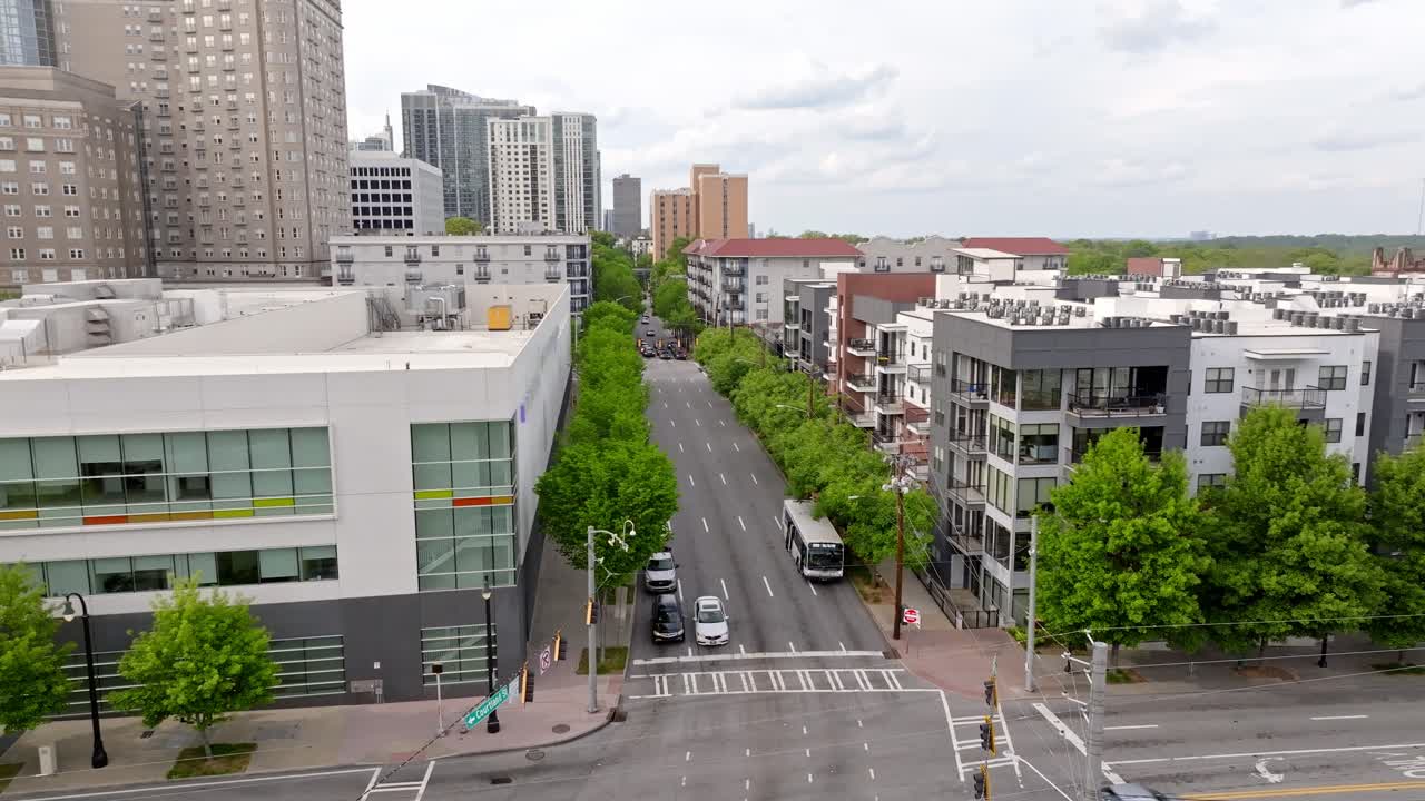 Traffic signal intersection, green trees lined suburban city streets, Peachtree Center, Atlanta, Georgia, Aerial