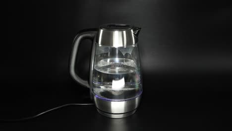 sequential demonstration of water boiling in an electric kettle