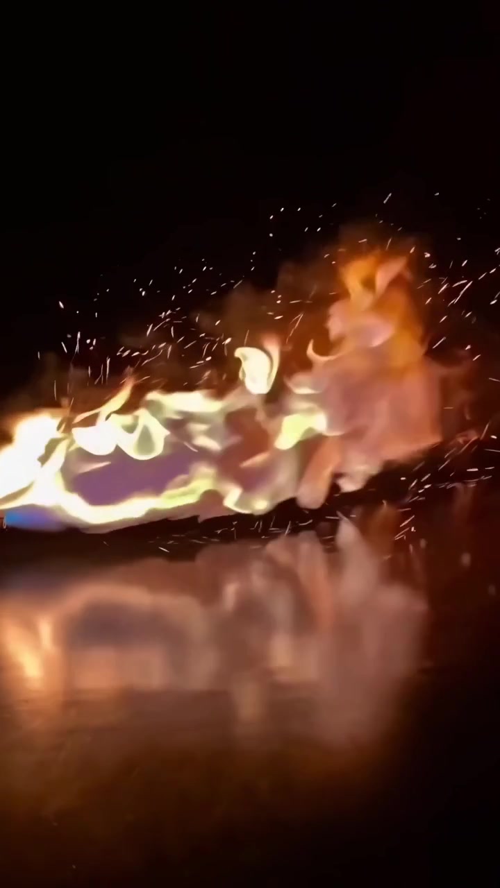Close-up of a Blowtorch Flame Burning on a Reflective Surface