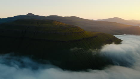 Majestic Mountain Landscape with Clouds at Dawn or Dusk