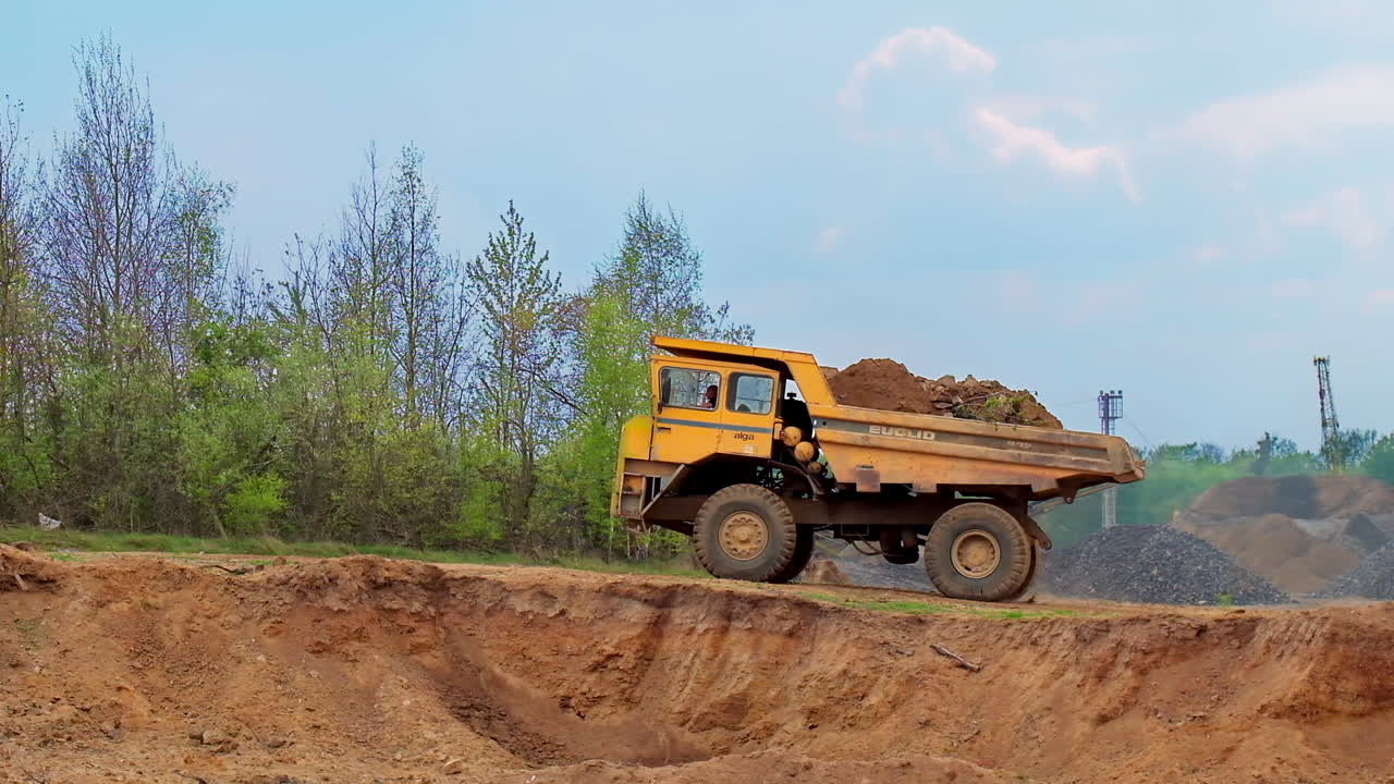 Large mining truck. Large quarry truck in the background of hills