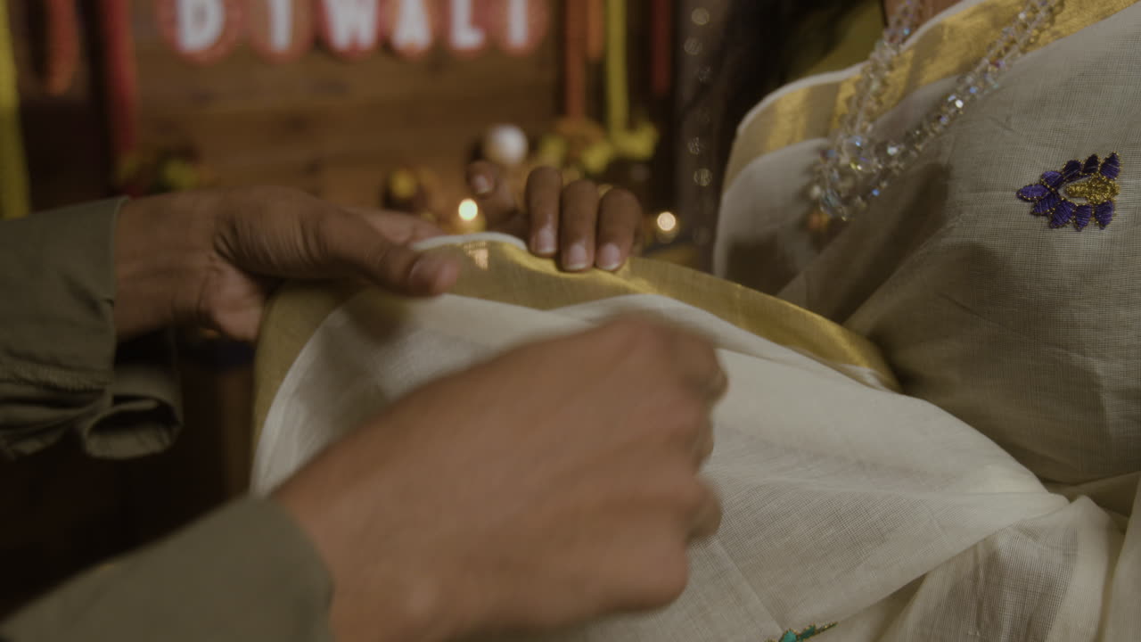 Indian attire and hands, possibly for Diwali or wedding