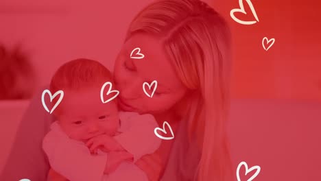 Animation-of-white-hearts-over-smiling-caucasian-woman-with-her-baby