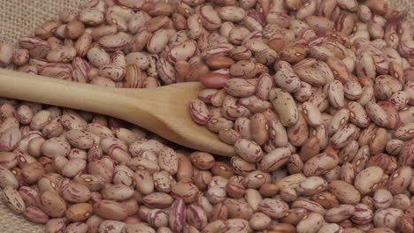 Dry-red-beans-legumes-on-wooden-spoon,-Mediterranean-healthy-diet,-vegan-vegetarian-veggie-protein-source-food