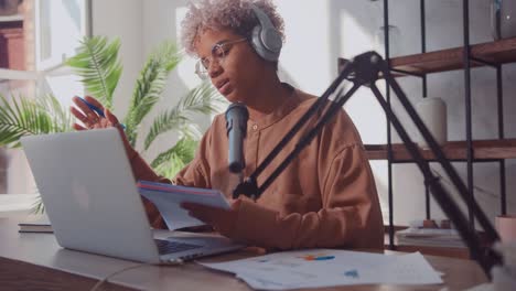 smiling influencer african american woman recording video for fashion blog
