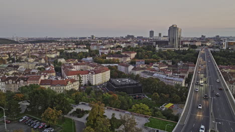 prague czechia aerial v123 flyover nuselsky most capturing traffics on the street bridge, dusk cityscape of nusle district featuring modern congress center - shot with mavic 3 cine - november 2022