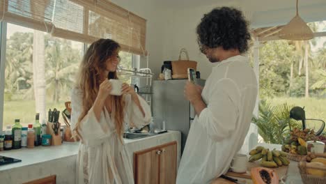couple enjoying coffee in a tropical kitchen
