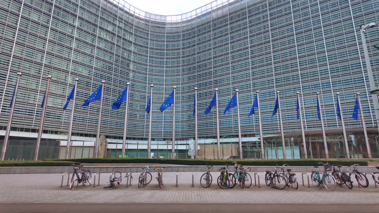 Bicycles parked in front of EU flags at Commission headquarters