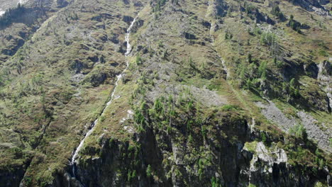 lush green mountain landscape with waterfalls