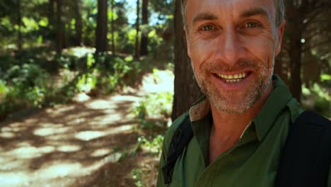 Portrait-of-man-standing-in-the-park