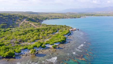 Tropical-untouched-coastline-of-Dominican-Republic,-sunny-day,-aerial