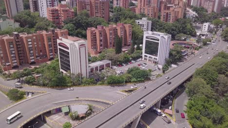 descending fast tilting aerial shot of aguacatala in medellin