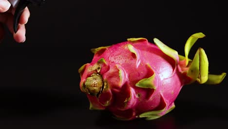 a dragon fruit being misted with water