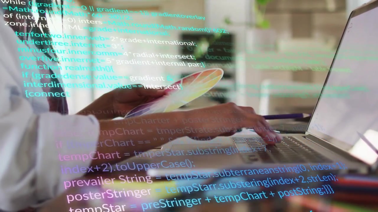 Woman scanning color swatches and typing on laptop, initiating animated code overlay for design