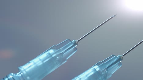 two syringes for both doses of the covid-19 vaccine - close up sliding isolated