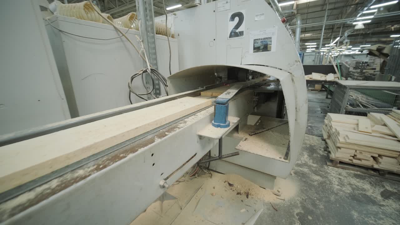 Wood Planks Moving on Conveyor Belt in Industrial Woodworking Factory