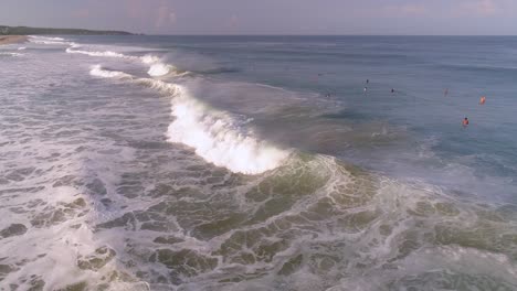 aerial drone shot of a surfer surfing a tube barrel wave in zicatela beach puerto escondido, oaxaca