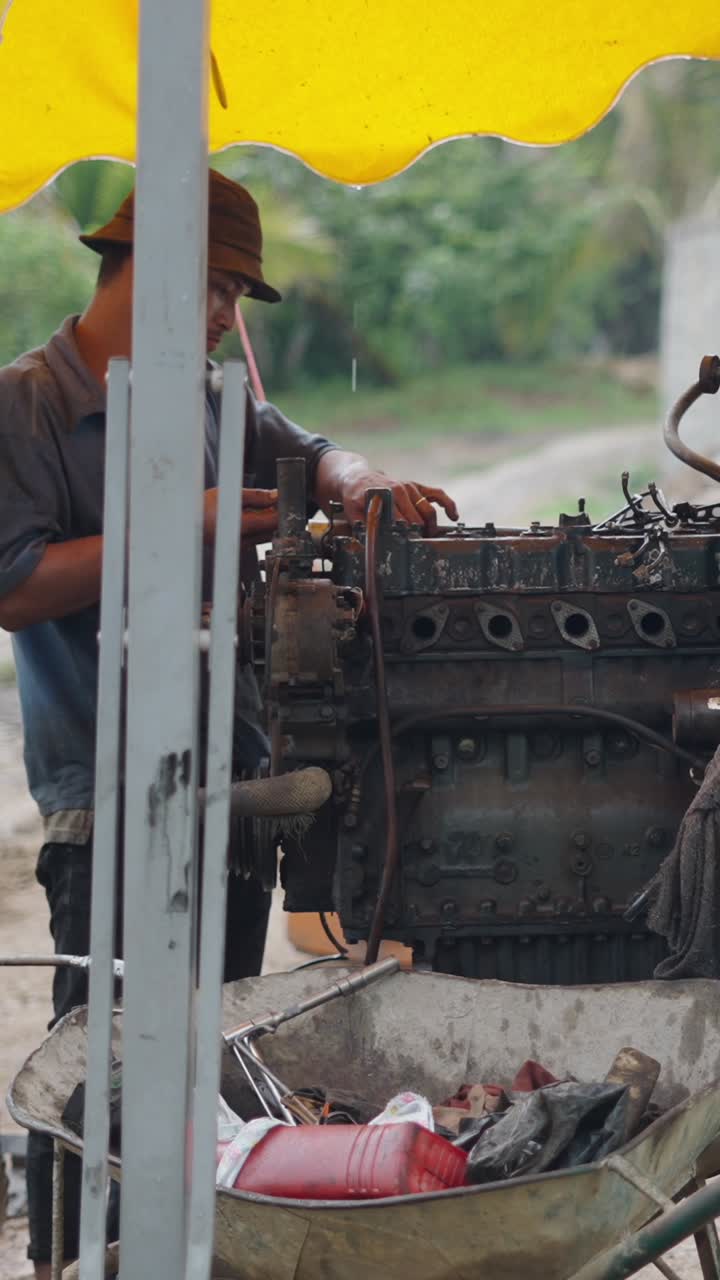 Mechanic Repairing an Engine