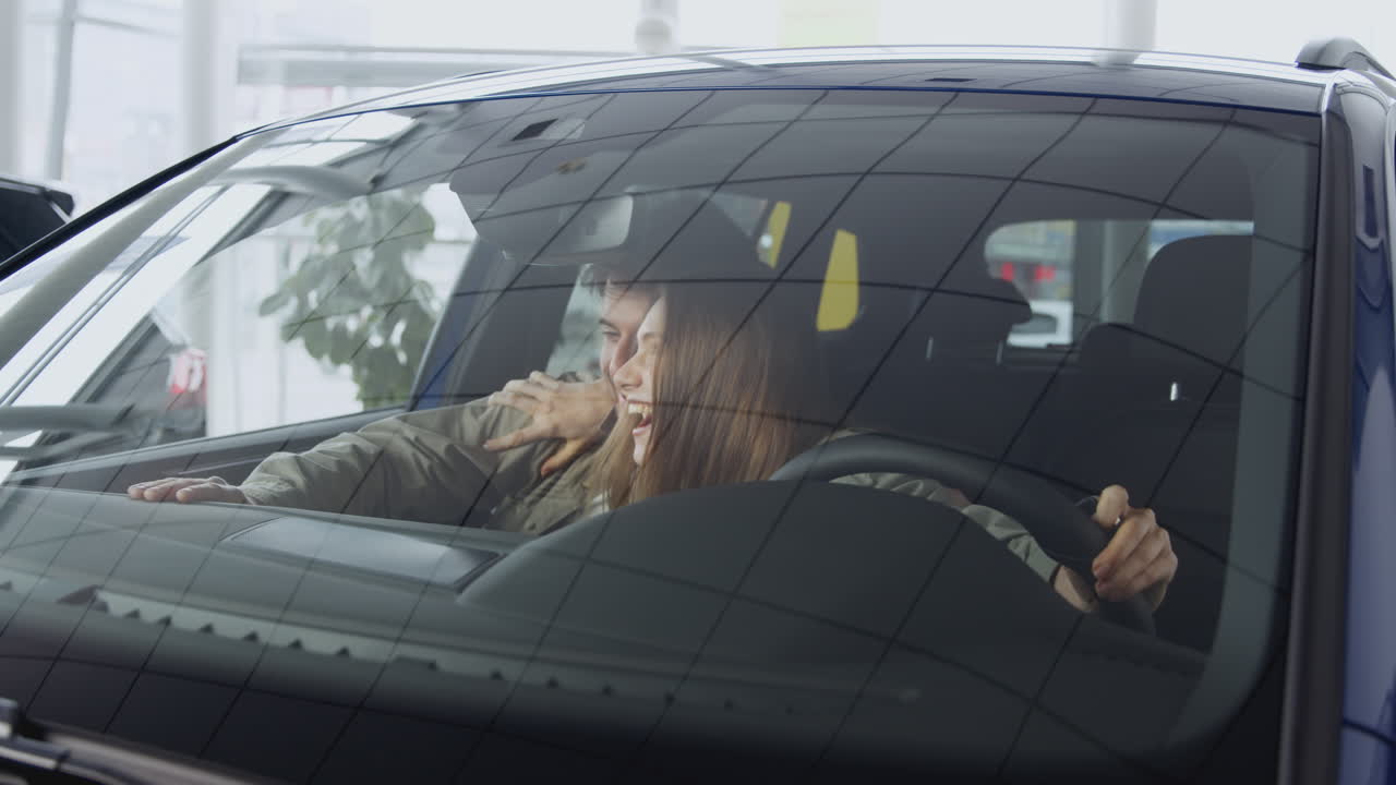 Happy Couple Shopping for a New Car