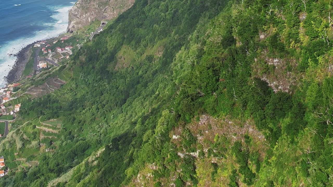 Drone view of lush hills and coastal scenery in Madeira, Portugal
