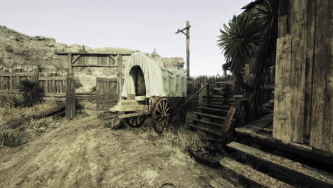 old wooden wagon in abandoned town with rustic buildings and desert landscape