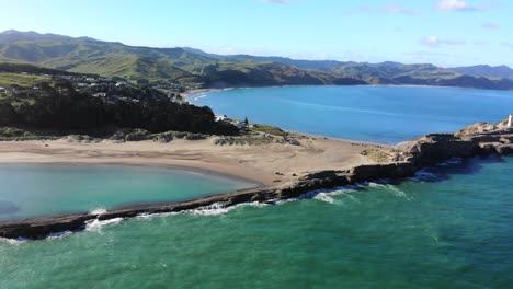 castlepoint scenic reserve and lighthouse in north island, new zealand with beautiful beach on a sunny day