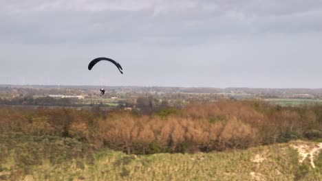 paragliding over dutch countryside