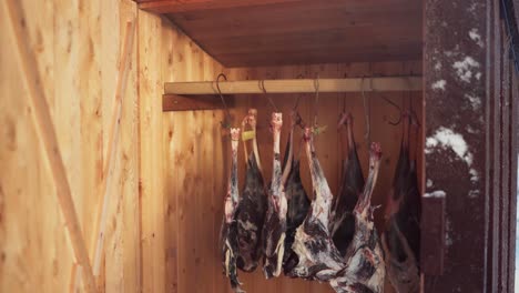 Roe-Deer-Legs-On-Hook-Hanging-Inside-The-Smokehouse-Using-Cold-Smoking-Method